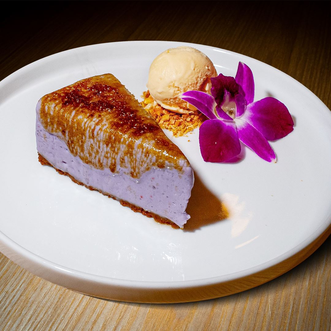 Taro Brûlée Cheesecake A slice of Taro Brûlée Cheesecake for dessert at a local asian restaurant in miami.