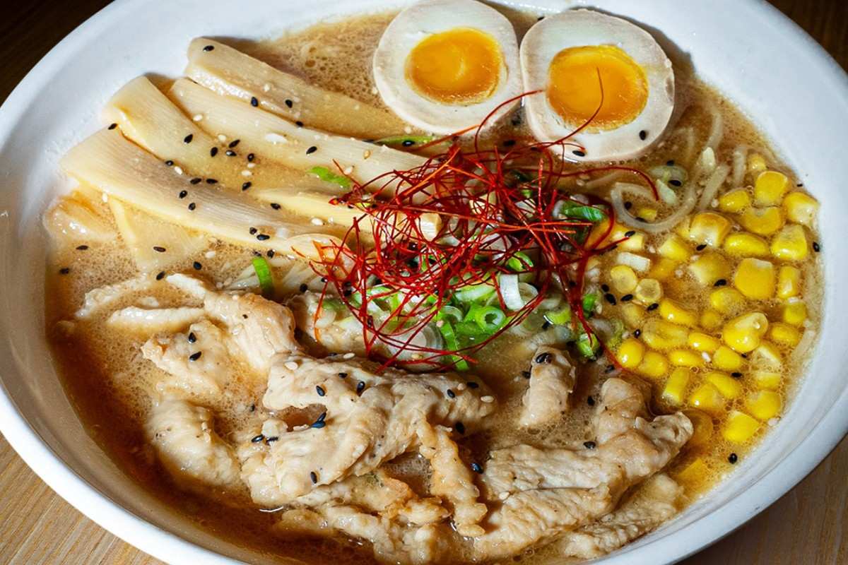 Close up view of a steaming bowl of authentic Miso Ramen at 107 Taste in Miami with toppings